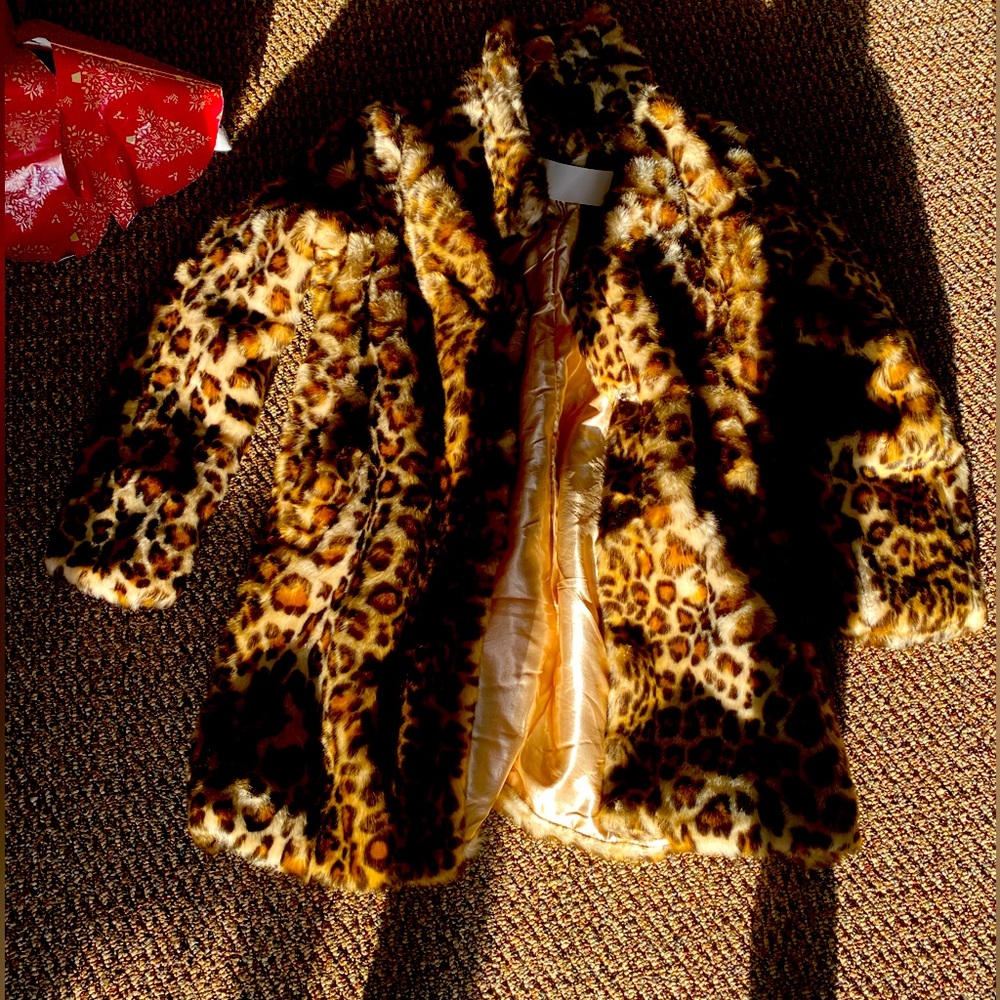 Fuzzy leopard jacket. Got it for Xmas and have no need. Never worn.